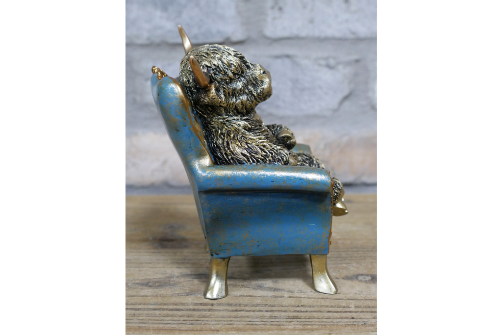 Highland Cow on a Chair