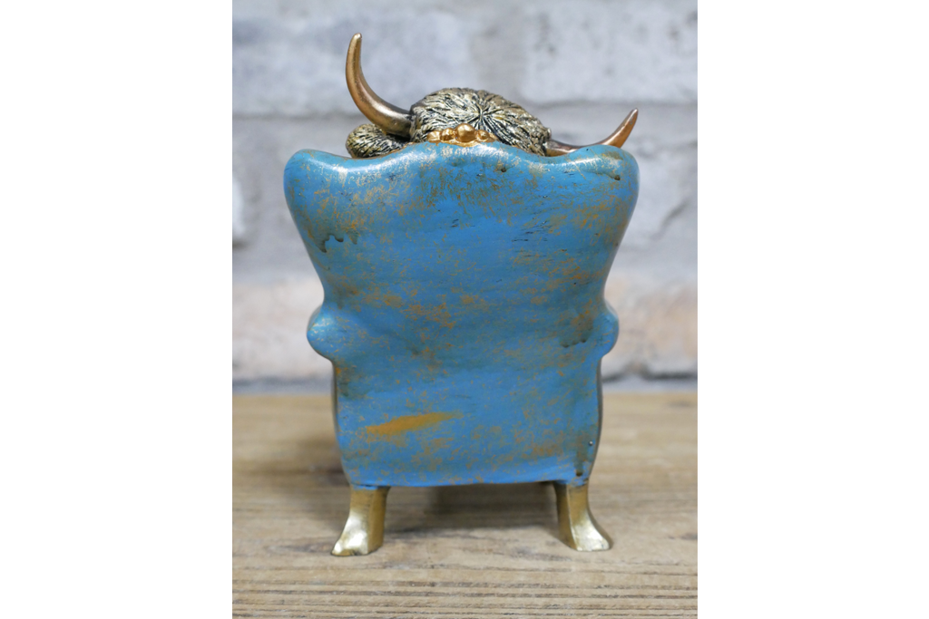 Highland Cow on a Chair