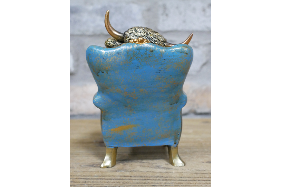 Highland Cow on a Chair